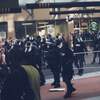 Innocent cops attacking vicious crowd.